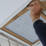 Man,Replacing,Dirty,Hvac,Air,Filter,In,Ceiling,Vent.,Home