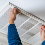 Man,Opening,Ceiling,Air,Vent,To,Replace,Dirty,Hvac,Air