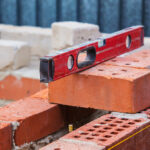 Construction,Of,Brick,Building,Building,Level,On,Bricks