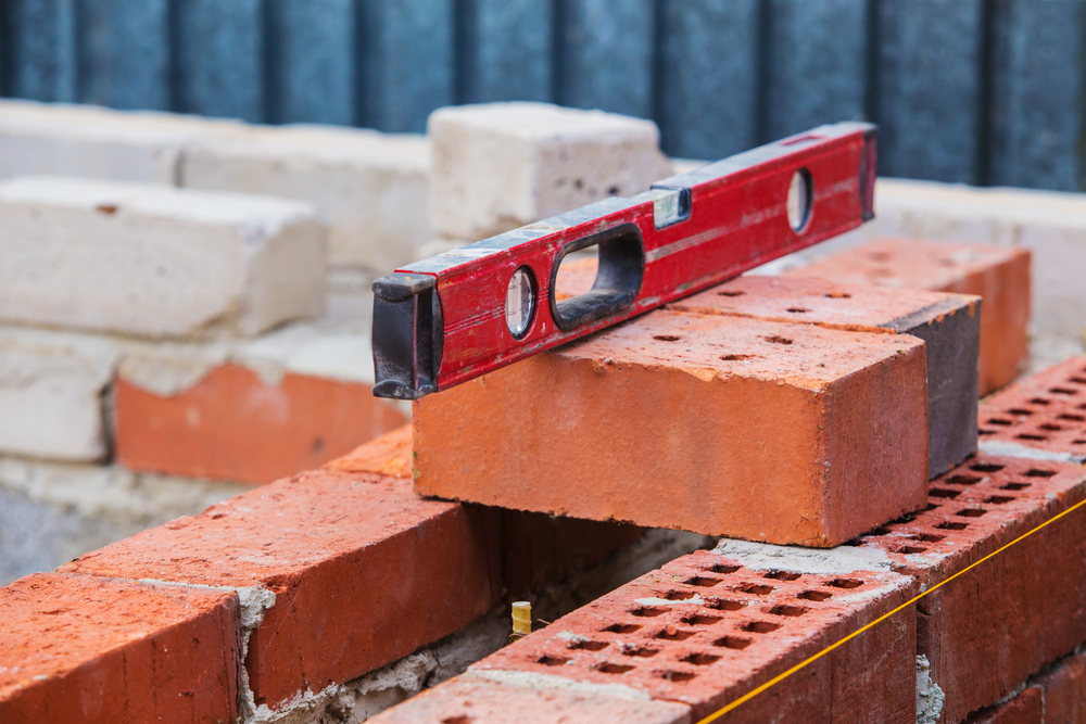 Construction,Of,Brick,Building,Building,Level,On,Bricks